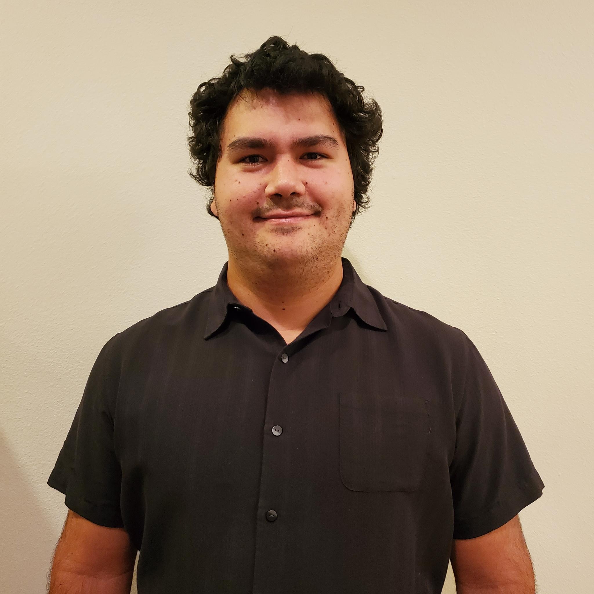 Picture of a male representing person wearing a collared shirt